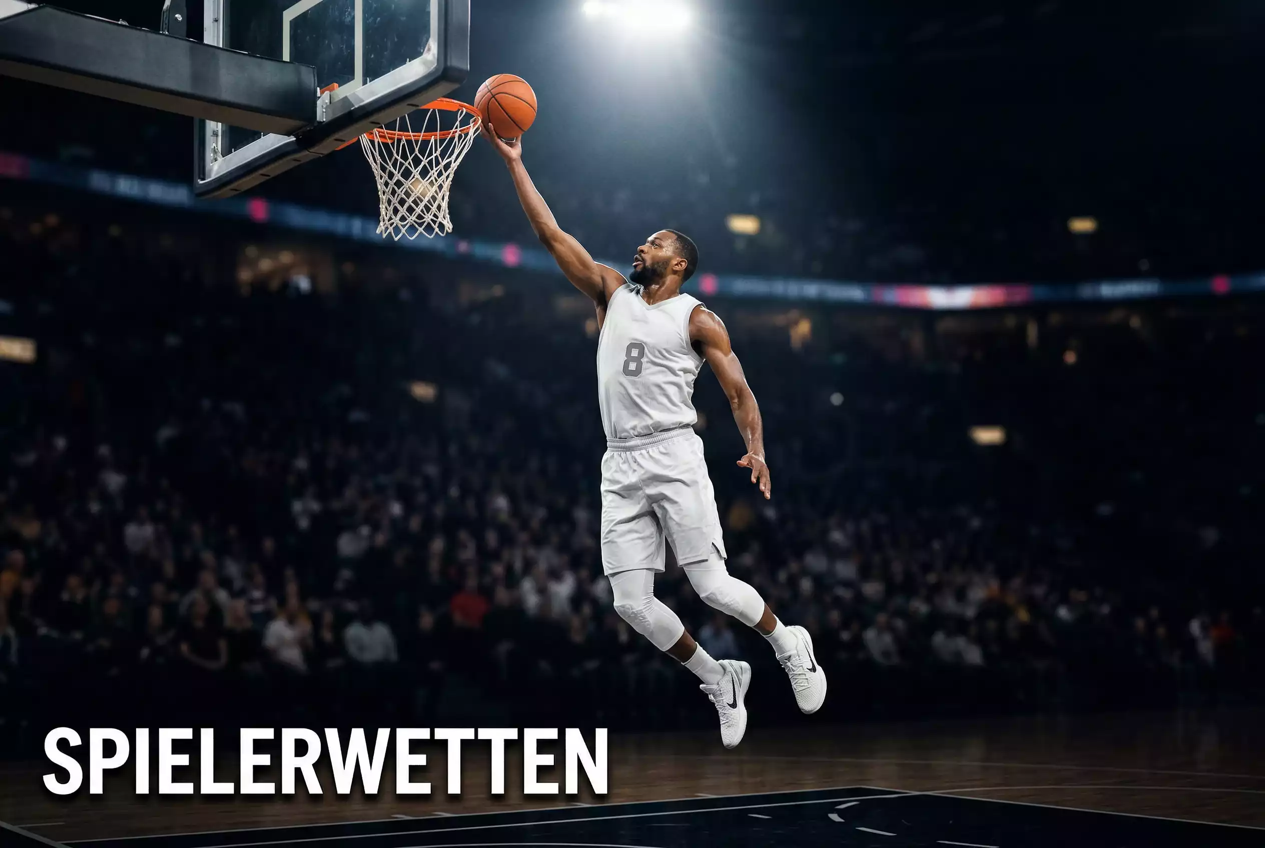 Basketball Spielerwetten – Basketballspieler beim Korbleger unter dem beleuchteten Korb